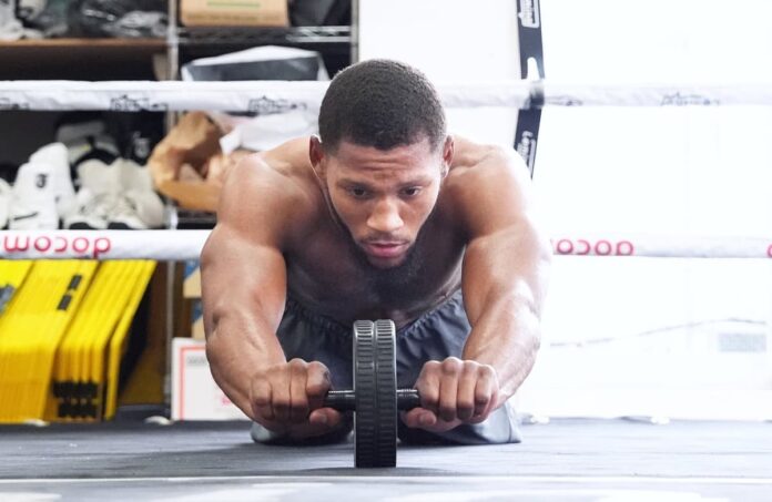 Brian Norman Jr using an ab wheel for core training