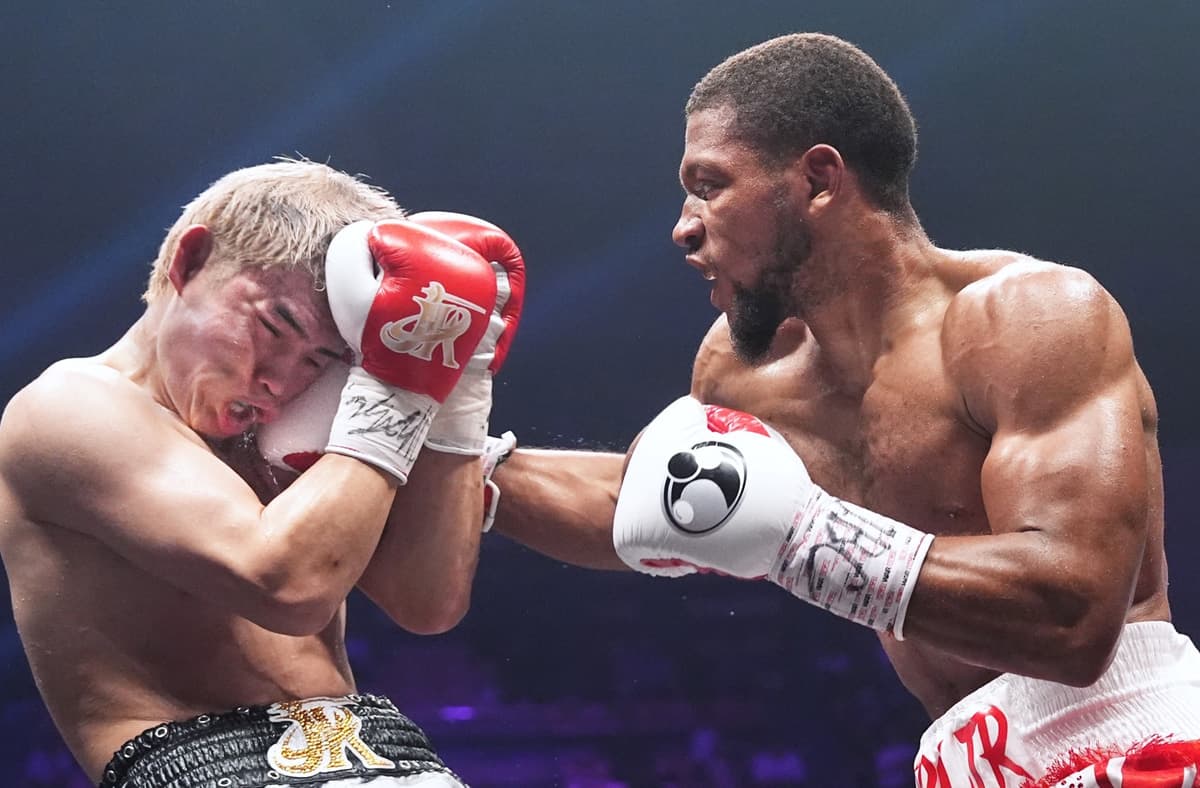 Brian Norman Jr punches Jin Sasaki during their boxing bout in Tokyo