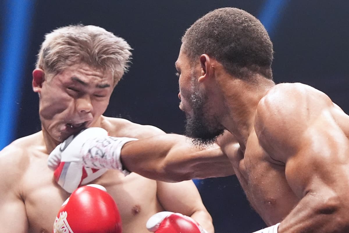 Brian Norman Jr punches Jin Sasaki during their boxing bout in Tokyo