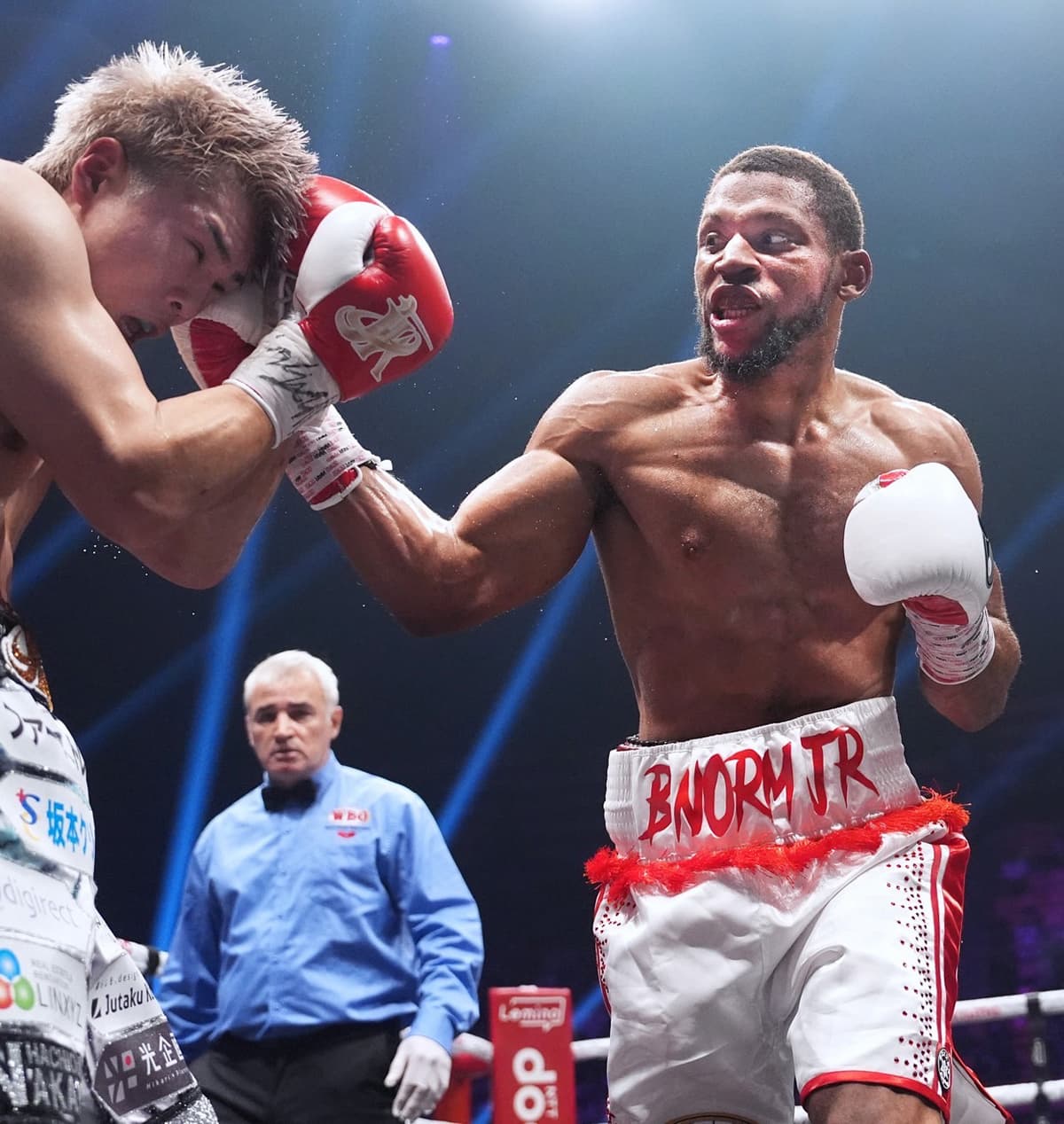 Brian Norman Jr punches Jin Sasaki during their boxing bout in Tokyo