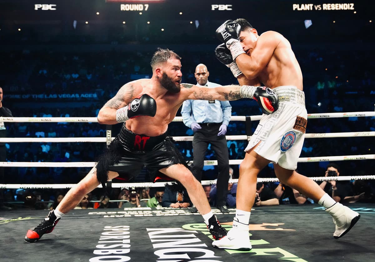 Caleb Plant punches Armando Resendiz during their boxing bout in Las Vegas