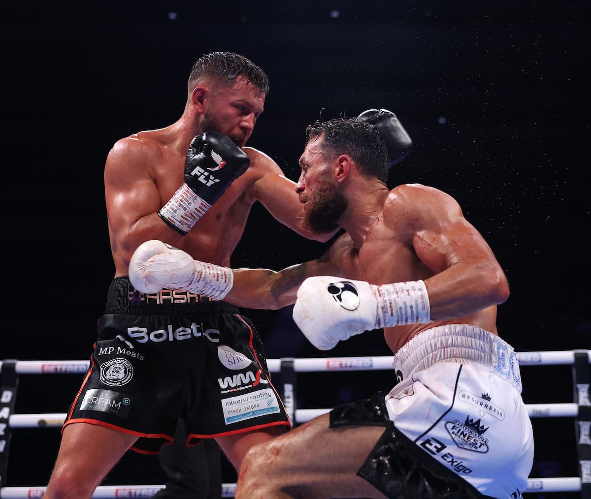 Conah Walker and Liam Taylor during their boxing bout in Birmingham, England