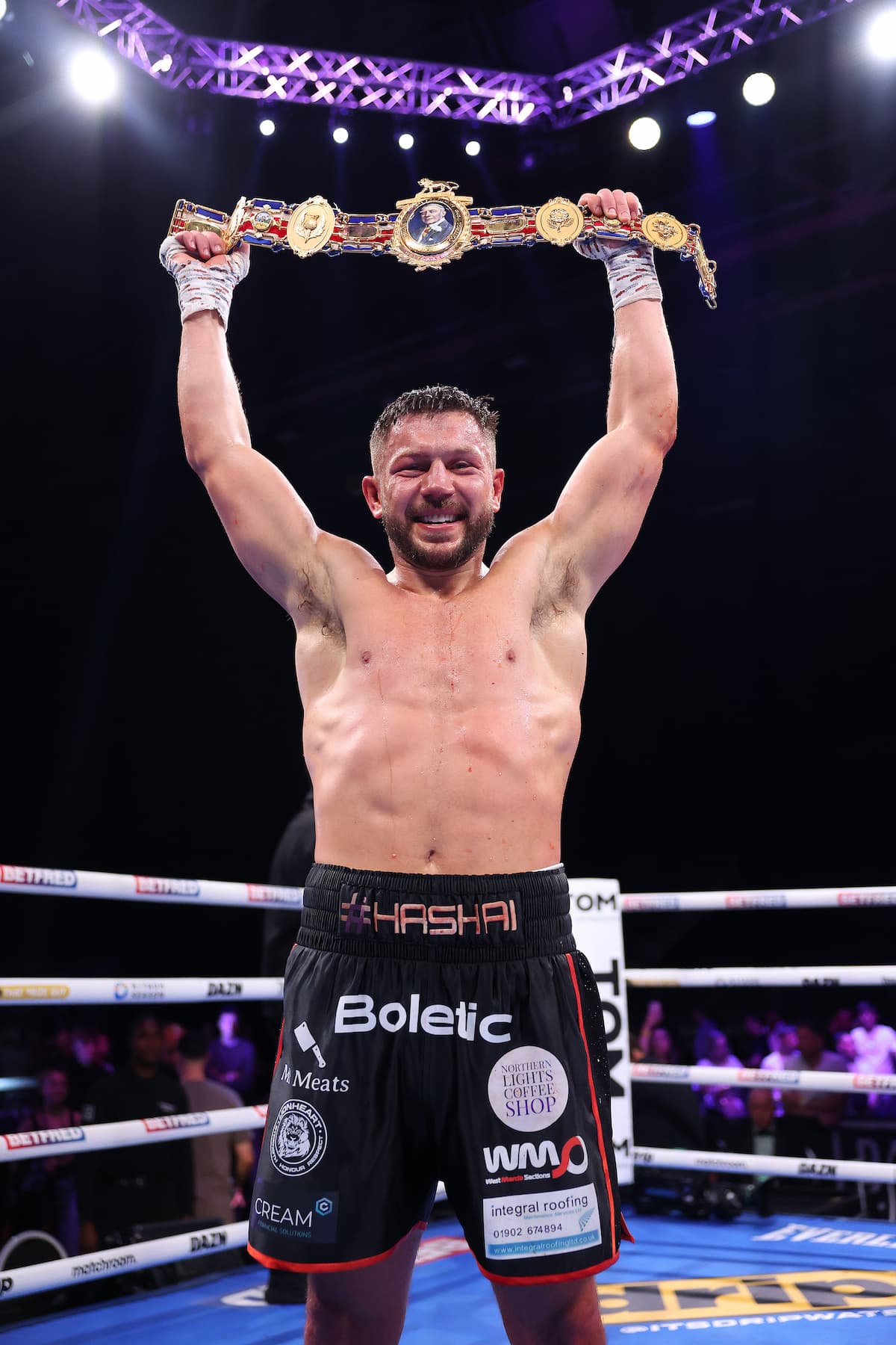 Conah Walker celebrates victory over Liam Taylor during their boxing bout in Birmingham, England