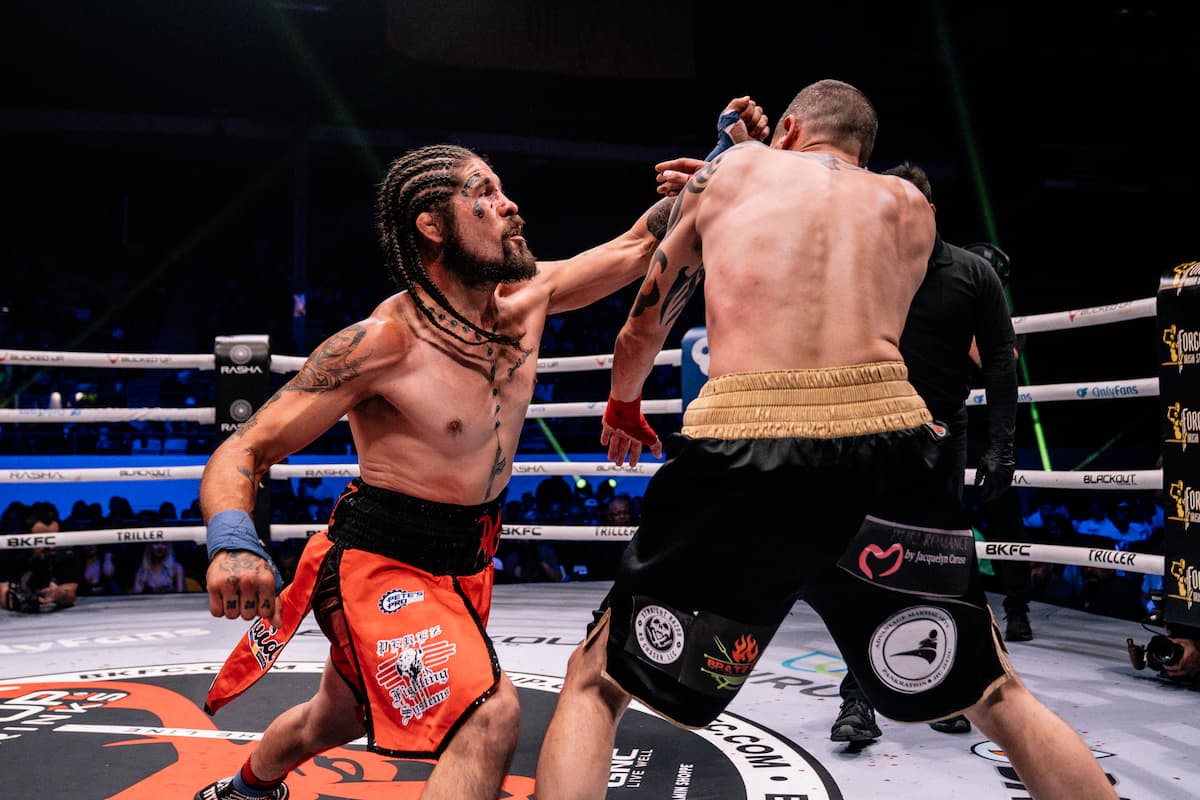 Derek Perez punches Rick Caruso during their bout at BKFC 75 Albuquerque