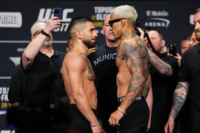 Ilia Topuria and Charles Oliveira face off at the UFC 317 ceremonial weigh-in, ahead of their MMA bout at T-Mobile Arena in Las Vegas