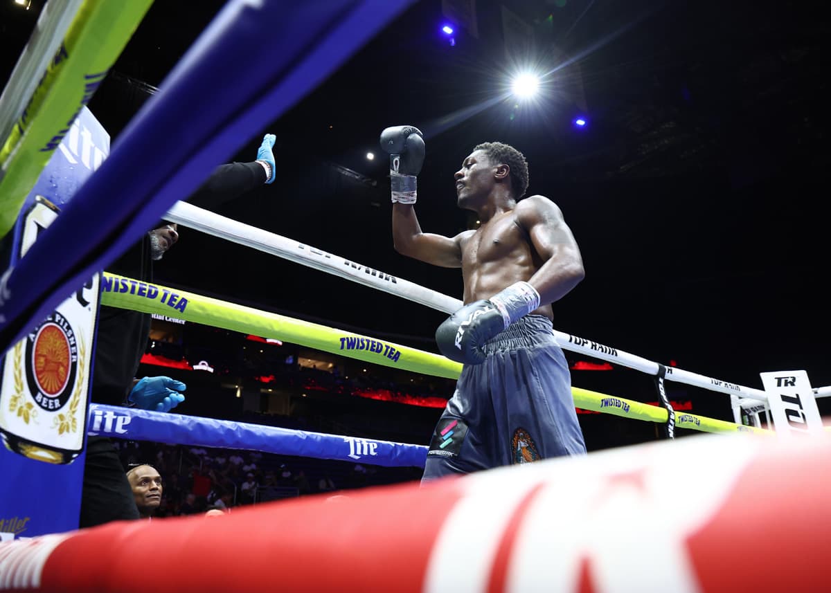 Jahi Tucker celebrates victory over Lorenzo Simpson during their boxing bout in Newark, New Jersey