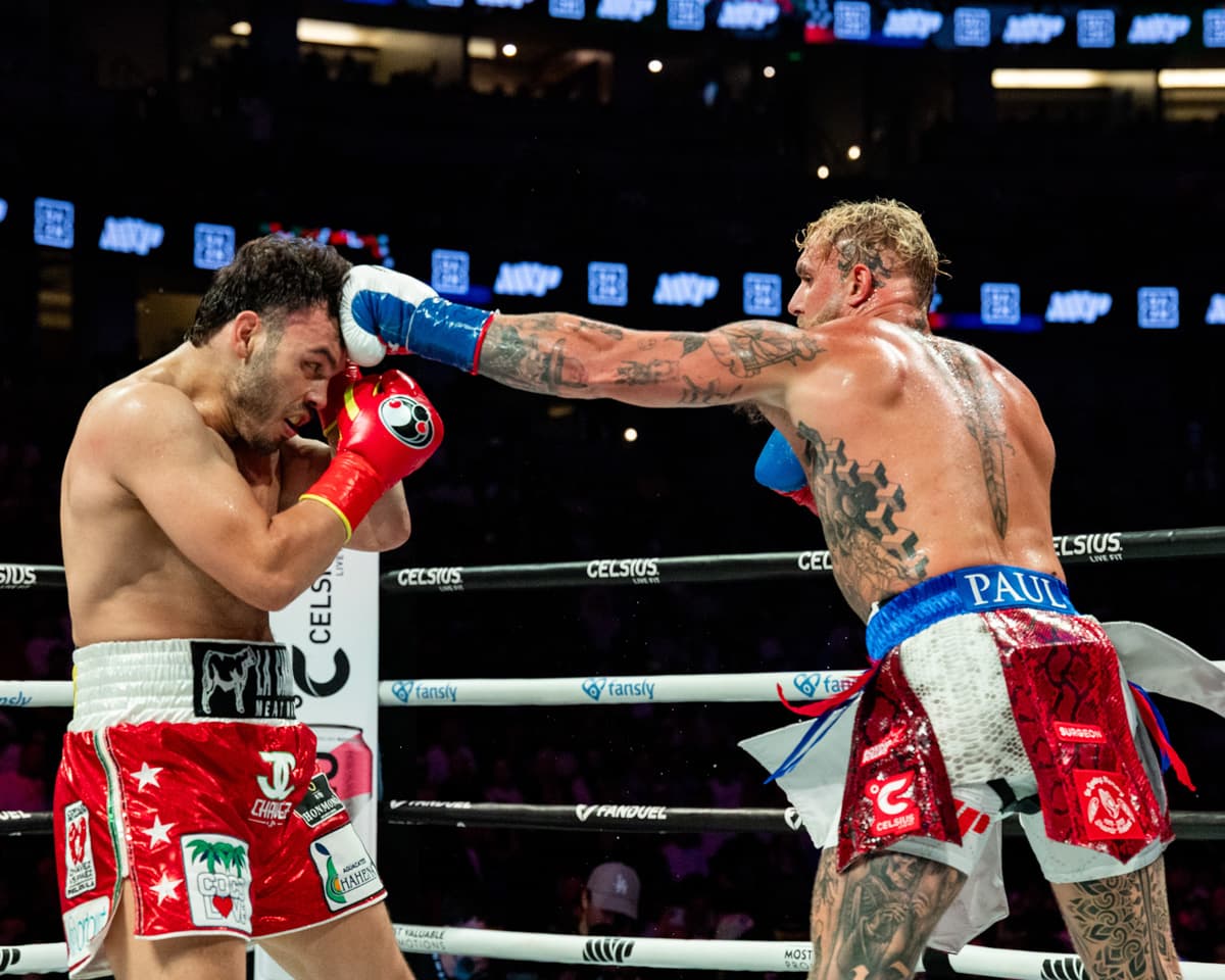 Jake Paul punches Julio Cesar Chavez Jr during their bout in Anaheim, CA