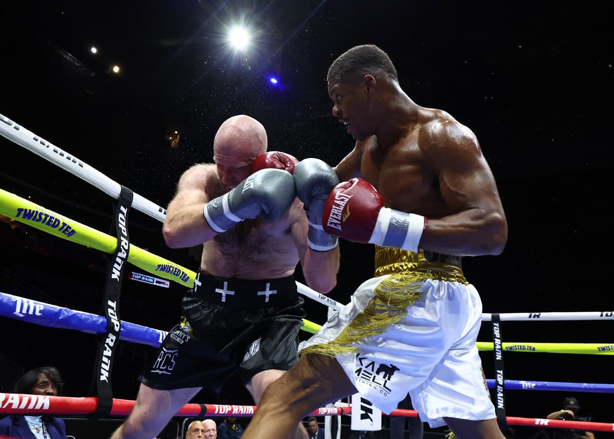 Jamar Talley punches Kurt Fleming during their boxing bout in Newark, New Jersey