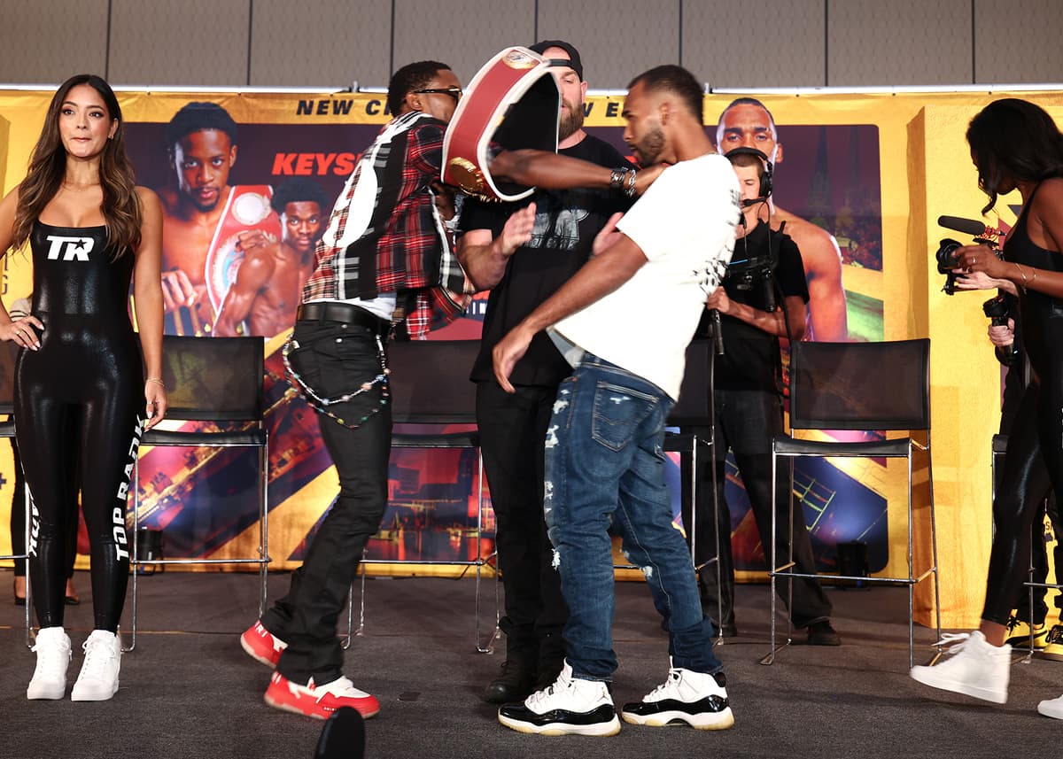Keyshawn Davis pushes Edwin De Los Santos at the press conference in Norfolk, VA