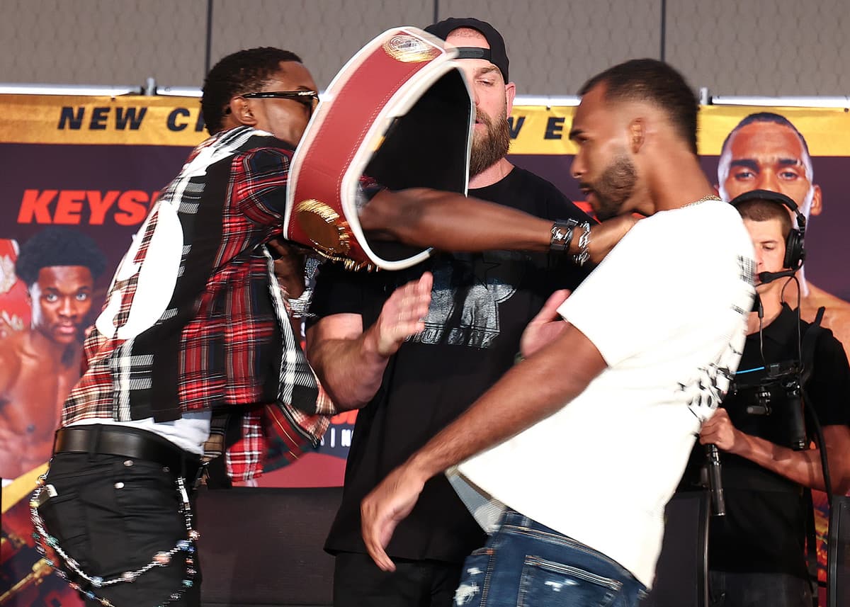 Keyshawn Davis pushes Edwin De Los Santos at the press conference in Norfolk, VA
