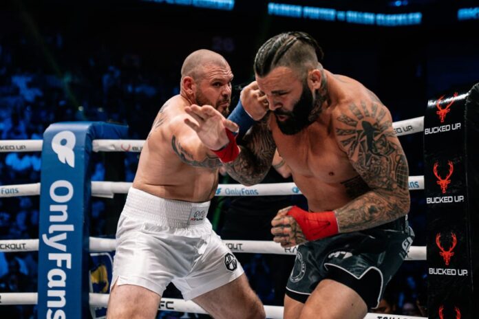 Parker Porter punches Dillon Cleckler during their bare-knuckle boxing bout at BKFC Mohegan Sun