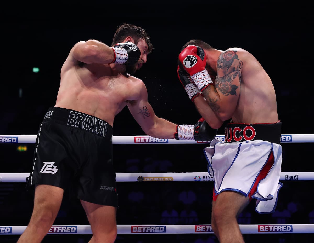 Pat Brown punches Ivan Duka during their boxing bout in Birmingham, England