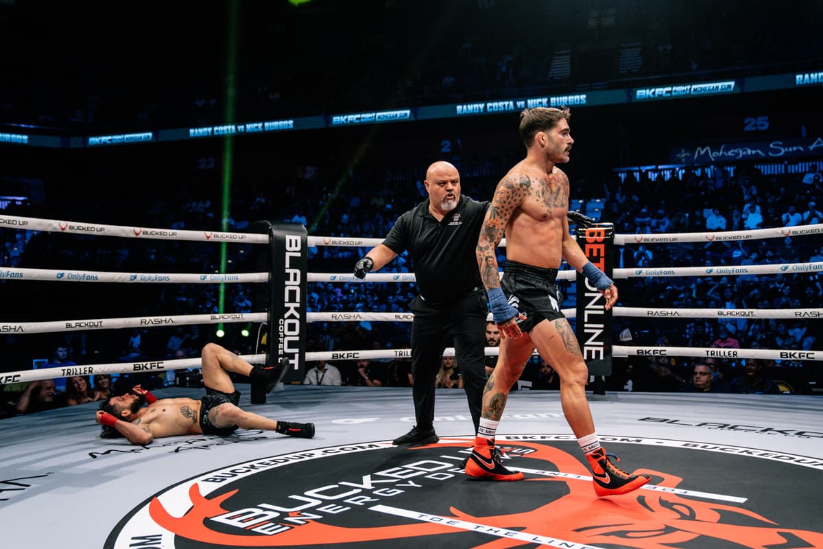 Randy Costa knocks down Nick Burgos during their bare-knuckle boxing bout at BKFC Mohegan Sun