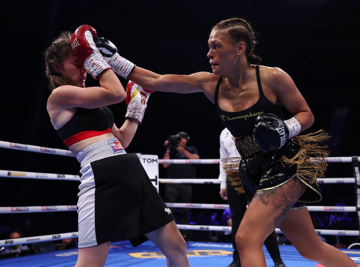 Tiah-Mai Ayton punches Sara Orszagi during their boxing bout in Birmingham, England