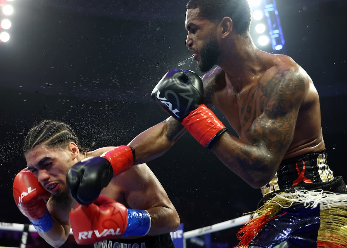 Tiger Johnson punches Janelson Figueroa Bocachica during their bout in Norfolk, VA