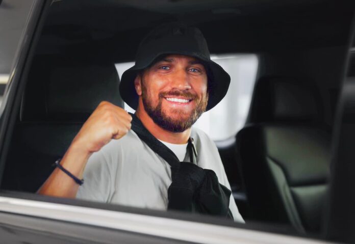 Vasiliy Lomachenko smiling during arrival in Los Angeles