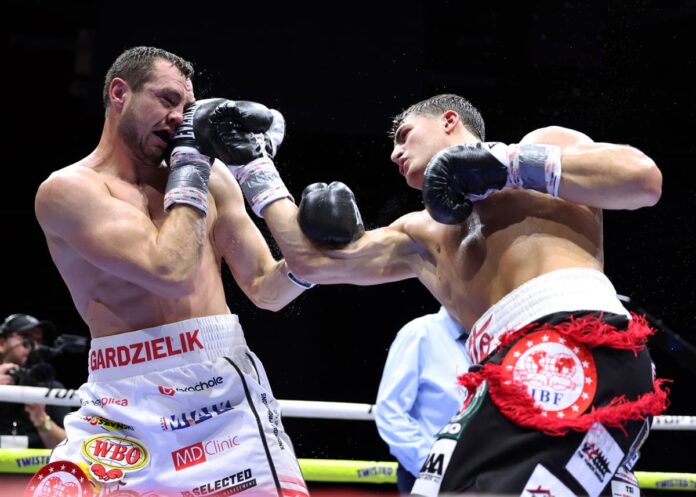 Vito Mielnicki Jr. punches Kamil Gardzielik during their boxing bout in Newark, New Jersey
