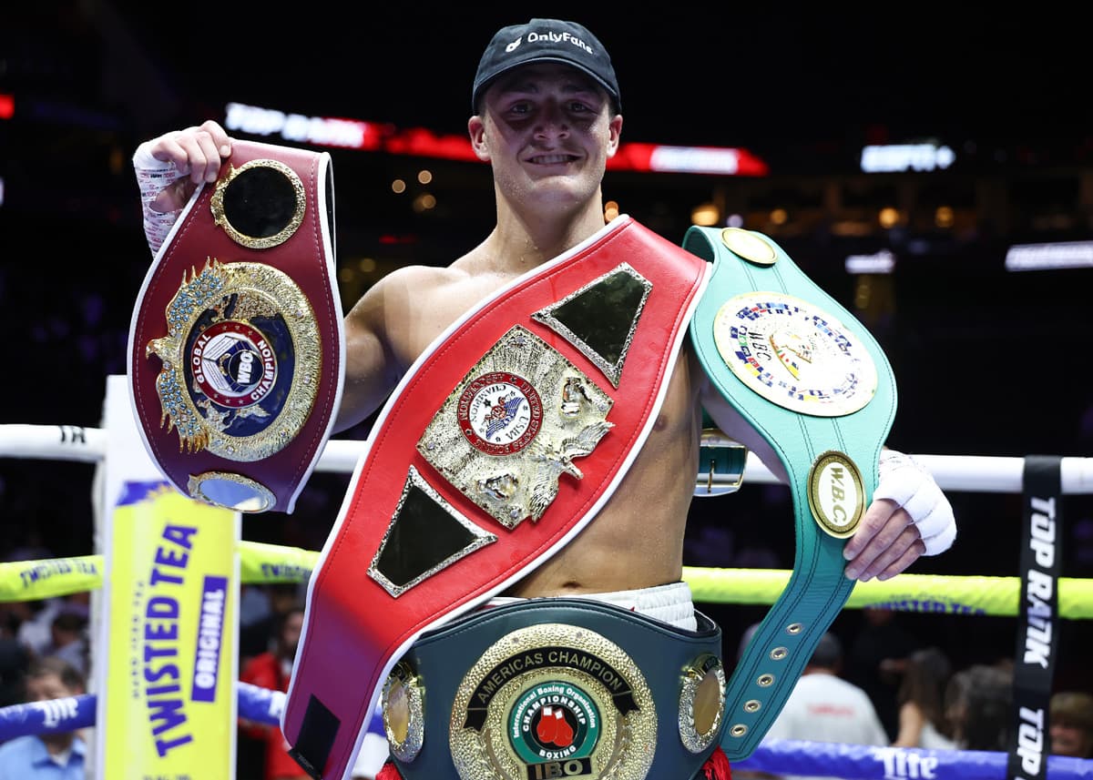 Vito Mielnicki Jr. with his belts after his victory over Kamil Gardzielik during their boxing bout in Newark, New Jersey
