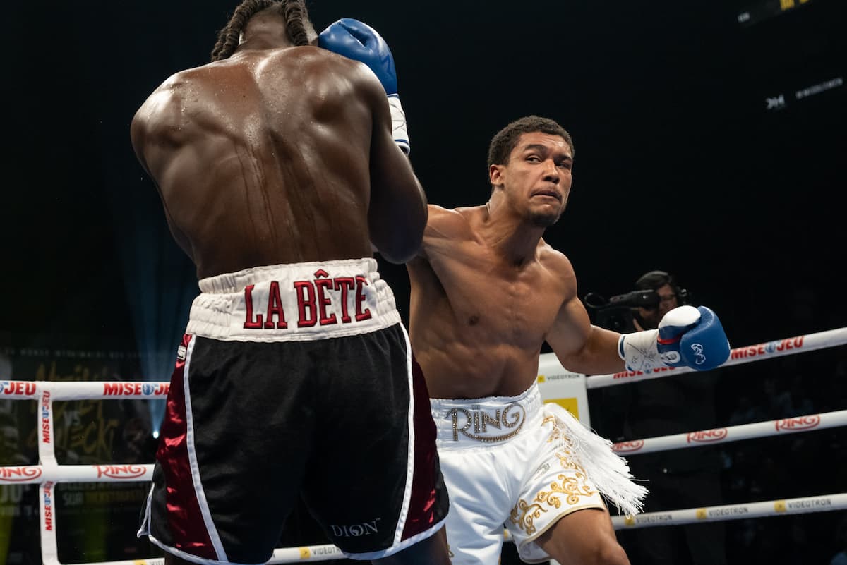 Wilkens Mathieu punches Adagio McDonald during their boxing bout in Québec City, Canada