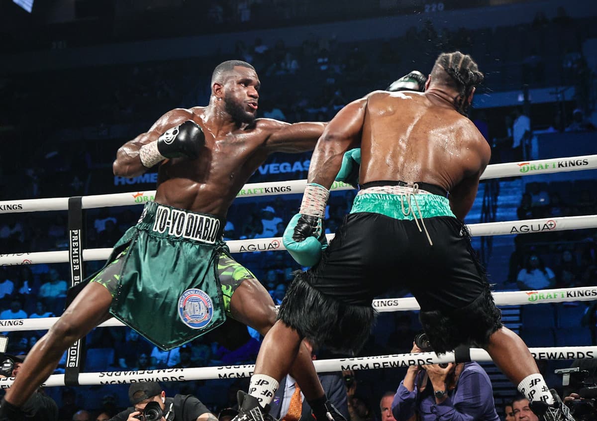 Yoenli Feliciano Hernandez punches Kyrone Davis during their boxing bout in Las Vegas