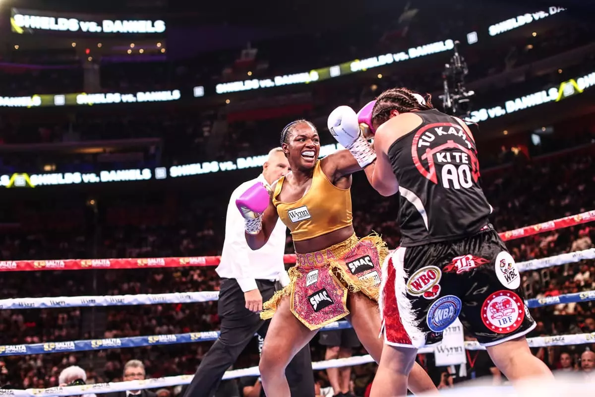 Claressa Shields punches Lani Daniels during their bout at Little Caesars Arena in Detroit