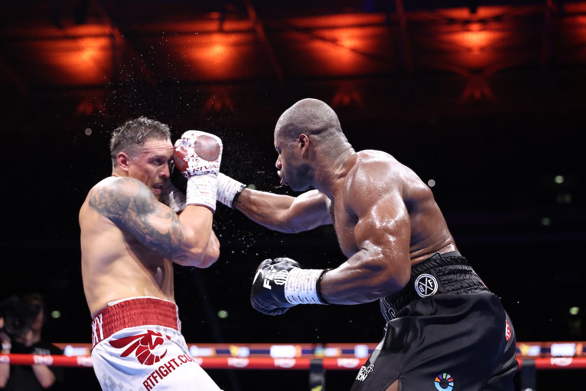 Daniel Dubois punches Oleksandr Usyk during their boxing bout at Wembley Stadium in London