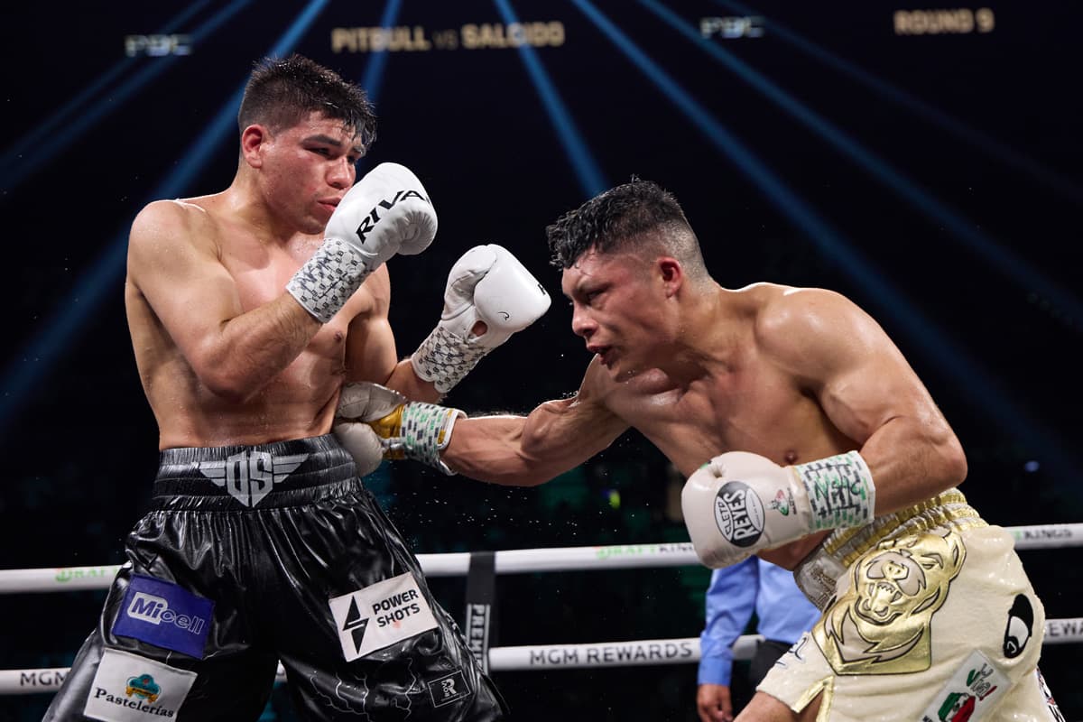 Isaac Cruz punches Omar Salcido Gamez during their bout at the MGM Grand Garden Arena in Las Vegas