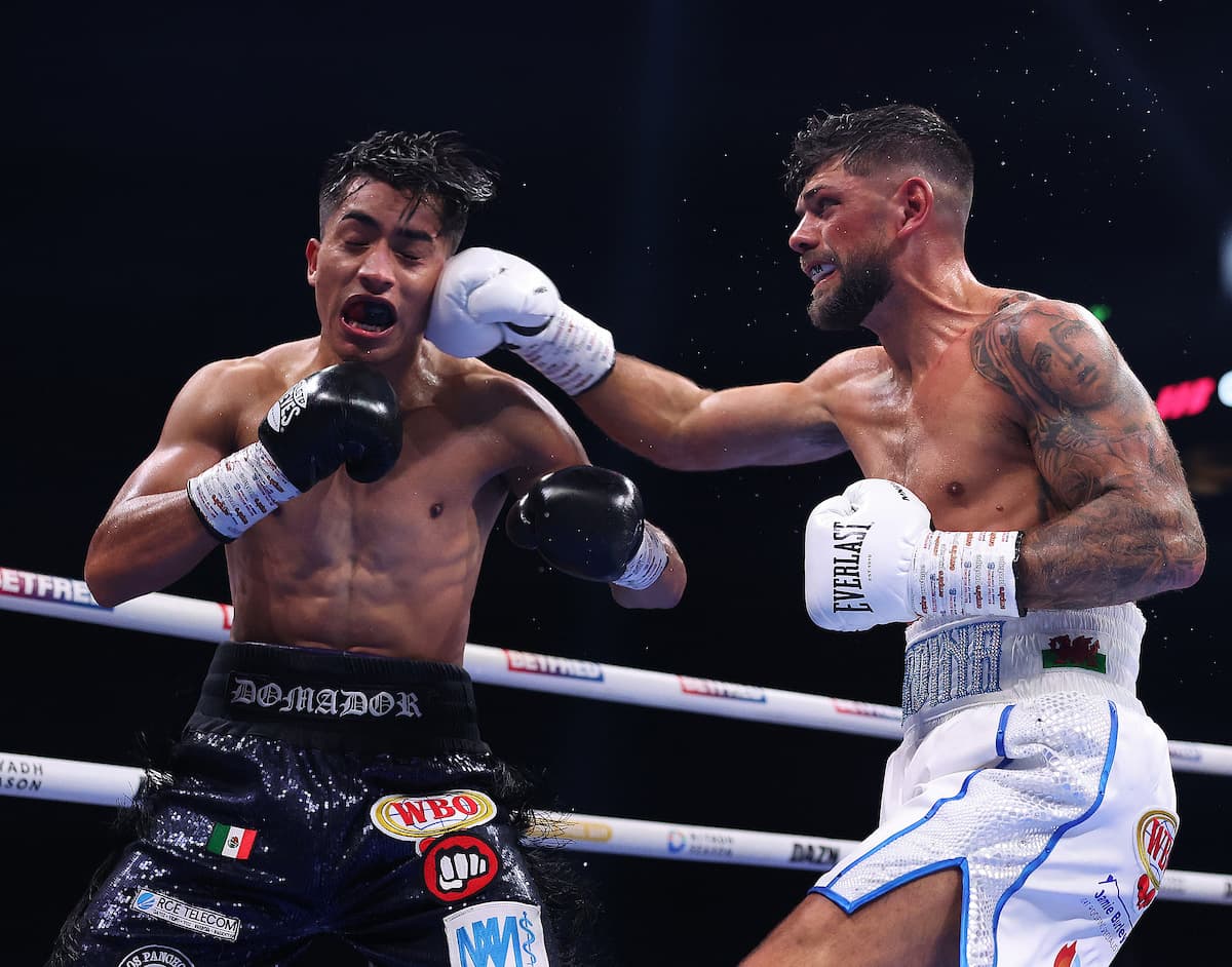 Joe Cordina punches Jaret Gonzalez Quiroz during their boxing bout in Manchester