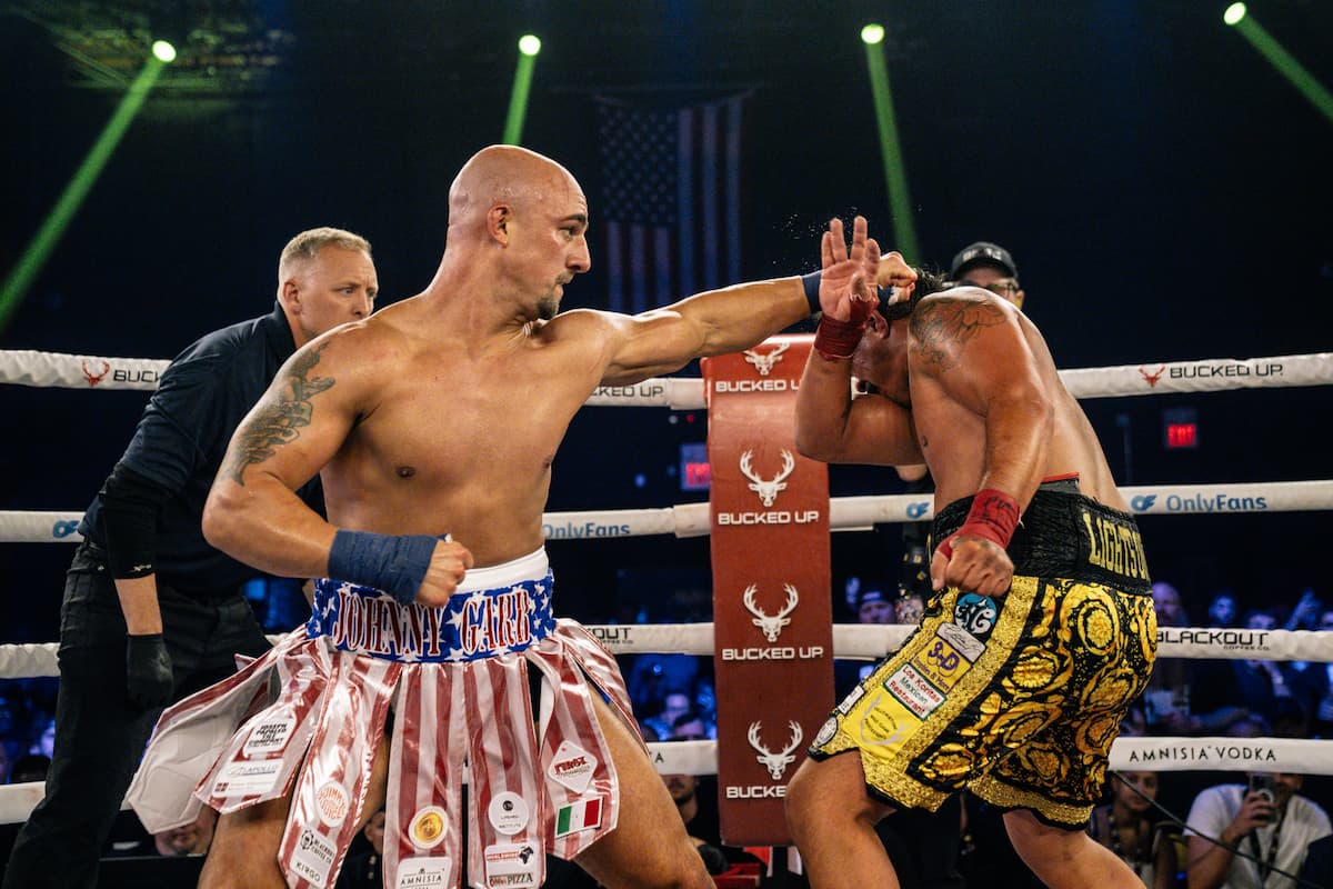 John Garbarino punches Eric Lopez during their bare-knuckle boxing bout at BKFC Philly