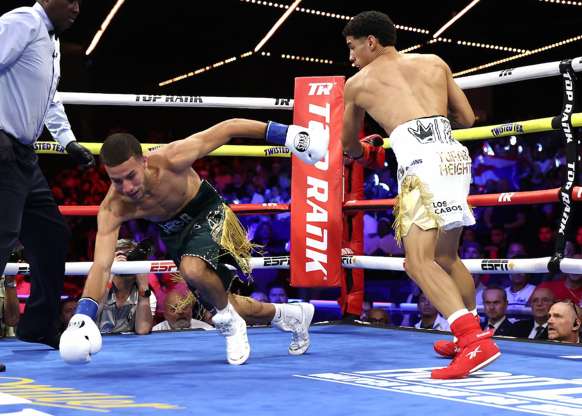Juanmita Lopez De Jesus knocks down Jorge Gonzalez-Sanchez during their bout at The Theater at Madison Square Garden in New York