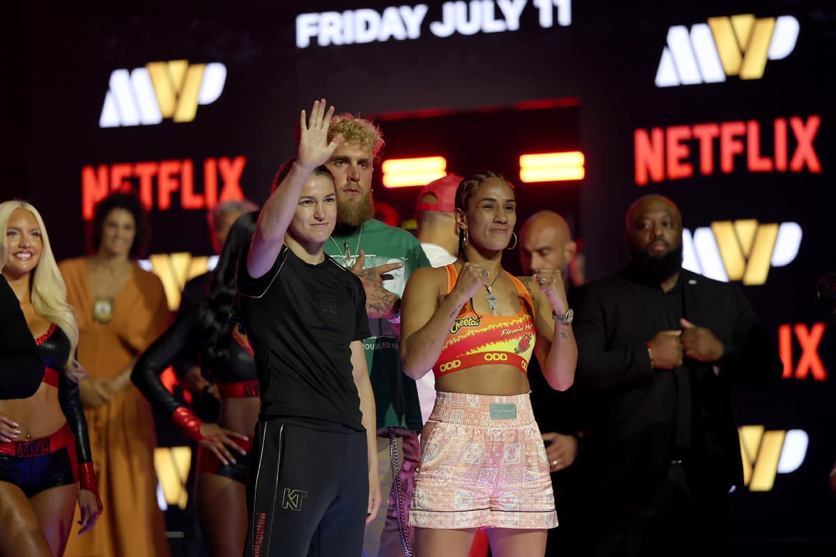Katie Taylor, Jake Paul and Amanda Serrano during the weigh-in in New York