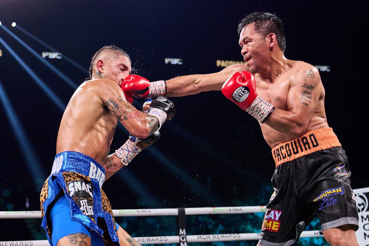 Manny Pacquiao punches Mario Barrios during their bout at the MGM Grand Garden Arena in Las Vegas