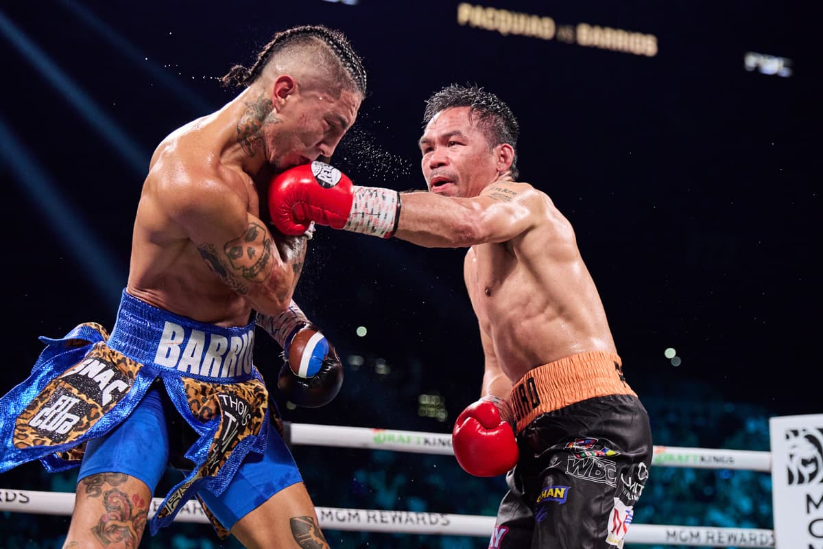 Manny Pacquiao punches Mario Barrios during their bout at the MGM Grand Garden Arena in Las Vegas