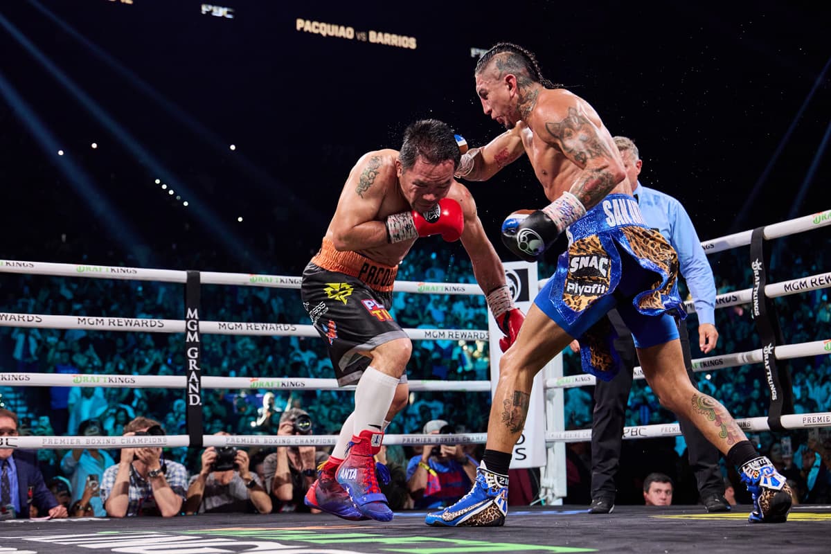 Mario Barrios punches Manny Pacquiao during their bout at the MGM Grand Garden Arena in Las Vegas