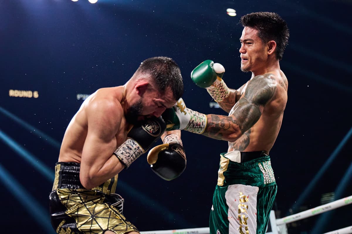 Mark Magsayo punches Jorge Mata Cuellar during their bout at the MGM Grand Garden Arena in Las Vegas