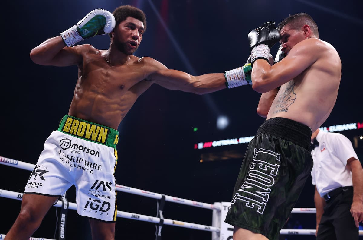 Niall Brown punches Victor Ionascu during their boxing bout in Manchester