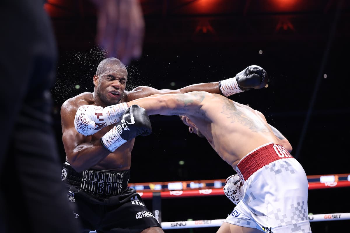 Oleksandr Usyk punches Daniel Dubois during their rematch at Wembley Stadium in London
