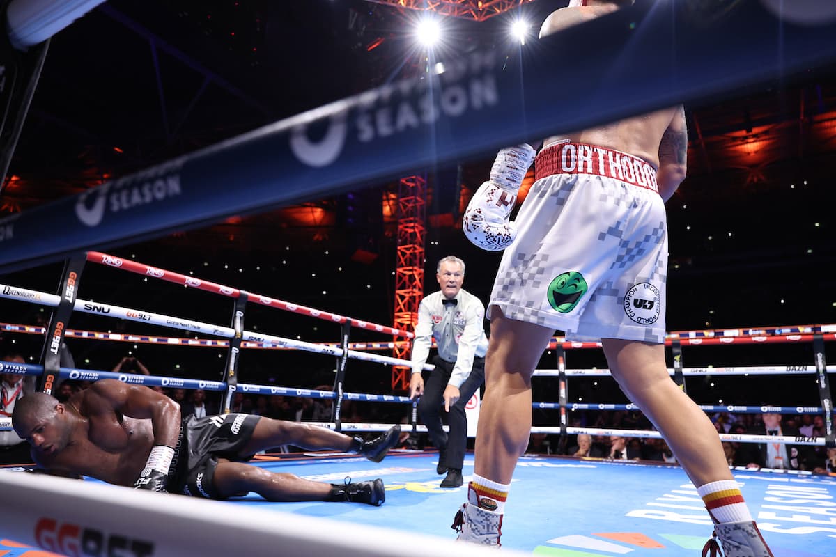 Oleksandr Usyk knocks down Daniel Dubois during their boxing bout at Wembley Stadium in London