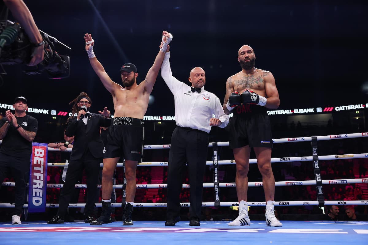 Pat Brown defeats Lewis Oakford during their boxing bout in Manchester