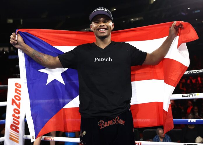 Shakur Stevenson holds the Puerto Rican flag after defeating Robson Conceicao at Prudential Center in Newark, New Jersey