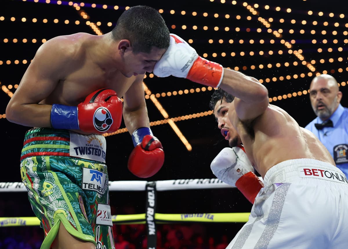 Xander Zayas punches Jorge Garcia Perez during their bout at The Theater at Madison Square Garden in New York