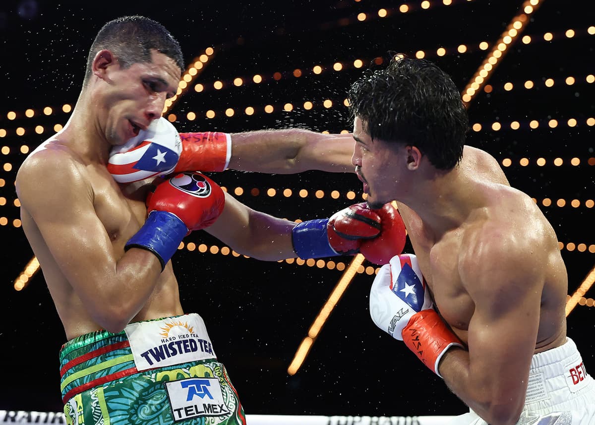 Xander Zayas punches Jorge Garcia Perez during their bout at The Theater at Madison Square Garden in New York