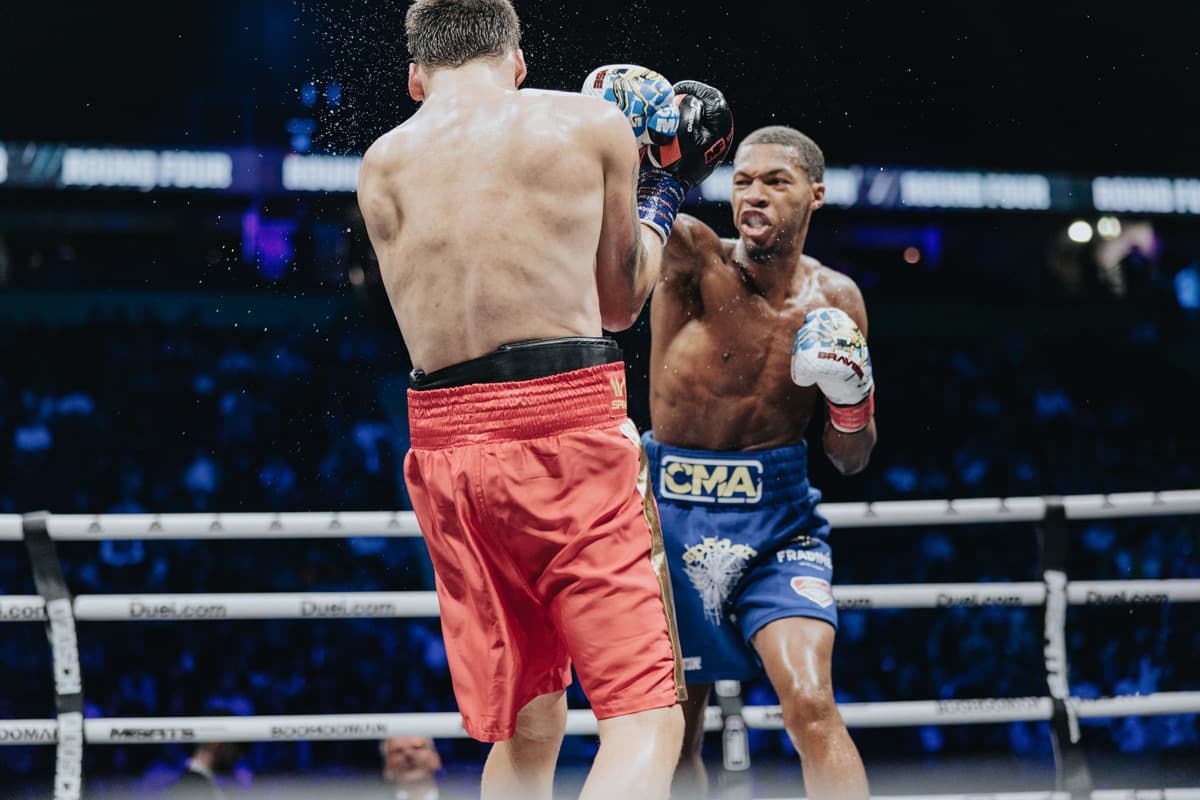 Amir Anderson punches Vitor Siqueira during their boxing bout