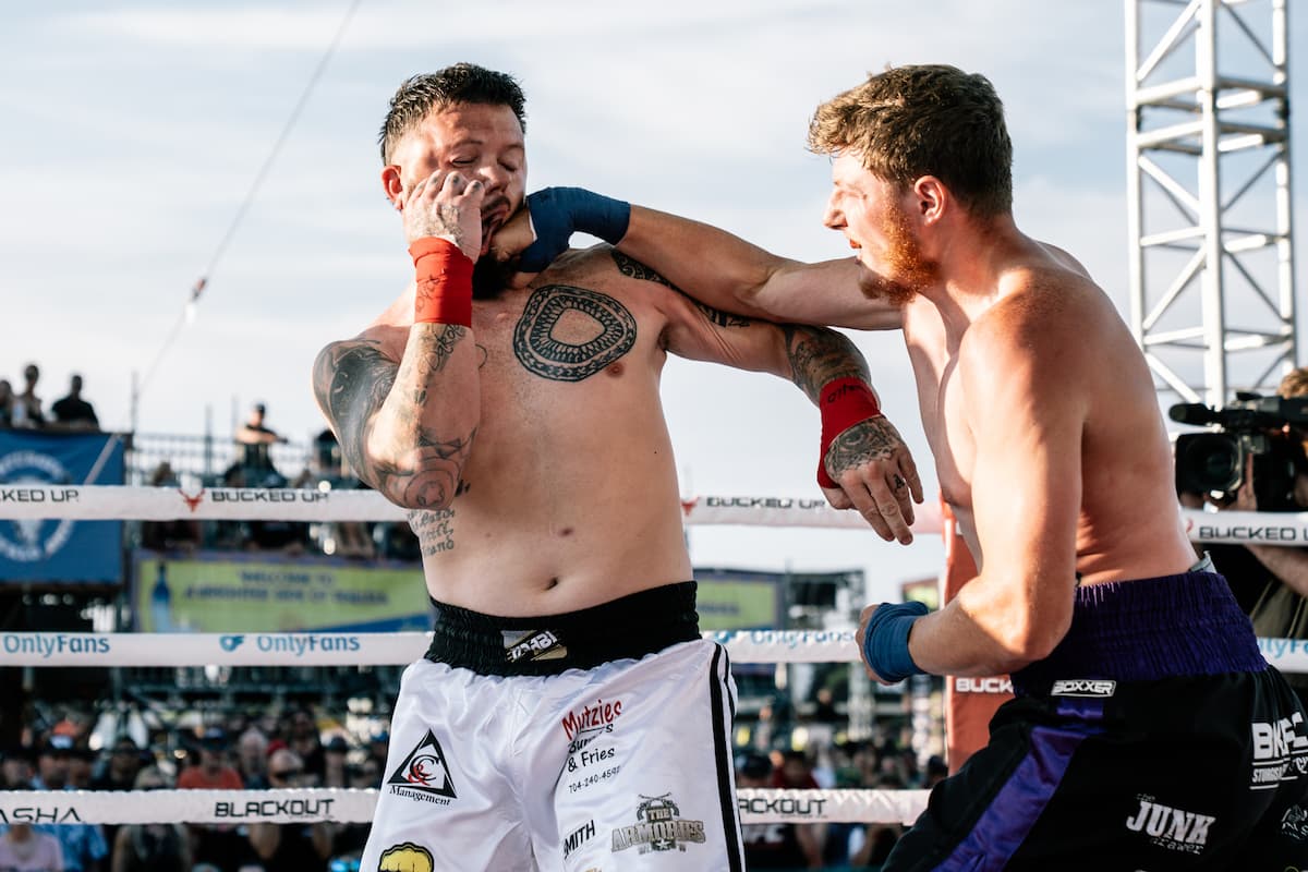 Cody Kerr punches Dillon Blaydon during their bare-knuckle boxing bout at the Legendary Sturgis Buffalo Chip in Sturgis, SD