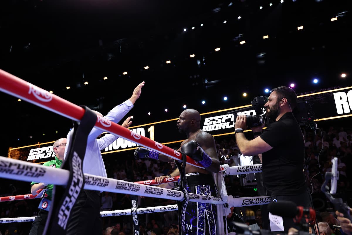 Referee waves the fight off after Dillian Whyte suffers a knockdown during his bout against Moses Itauma