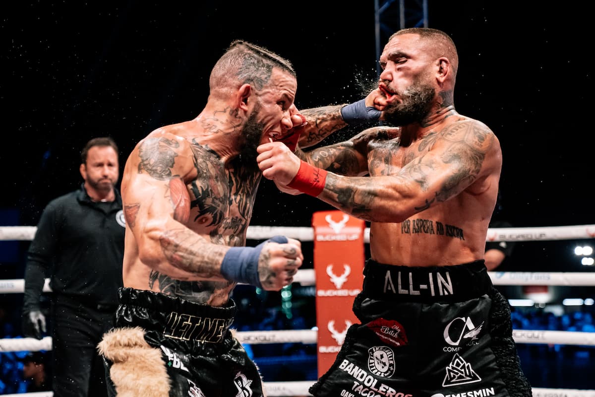 Julian Lane punches Gorjan Slaveski during their bare-knuckle boxing bout at the Legendary Sturgis Buffalo Chip in Sturgis, SD