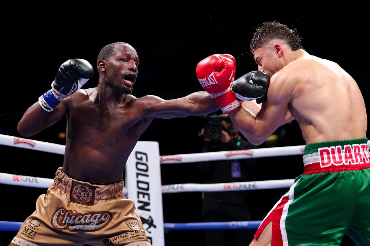 Kenneth Sims Jr. punches Oscar Duarte during their boxing bout in Chicago