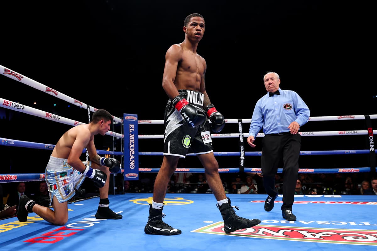 Mehki Phillips knocks down Joseph Ricardo Cruz Brown during their boxing bout in Chicago