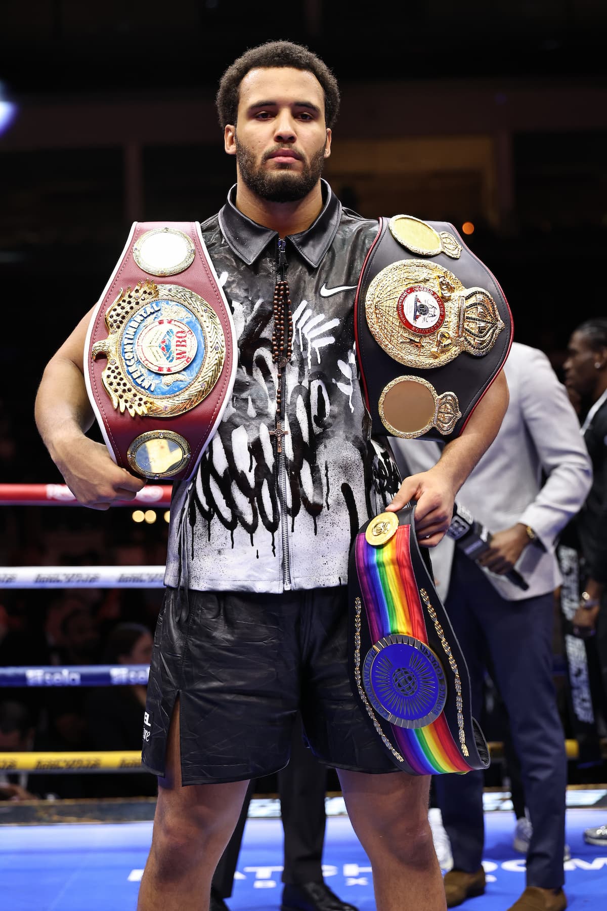 Moses Itauma with his championship belts after defeating Dillian Whyte