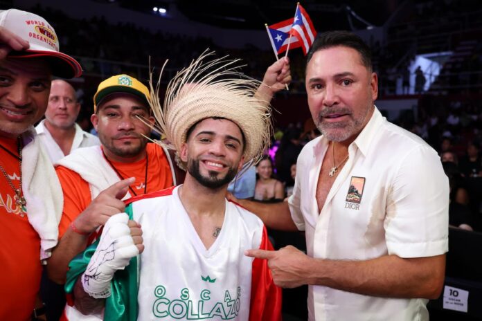 Oscar Collazo and Oscar De La Hoya pose together after Collazo's victory in a boxing match